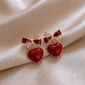 Elegante Herz-Ohrringe in Gold mit roter Schleife & Perlen-Details